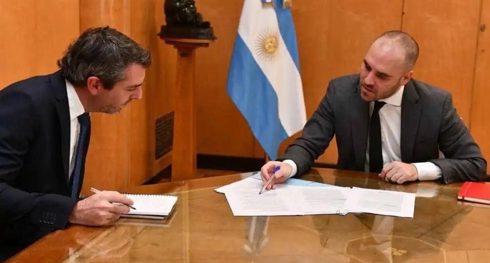 Guzmán junto al nuevo secretario de Comercio Interio, Guillermo Hang.